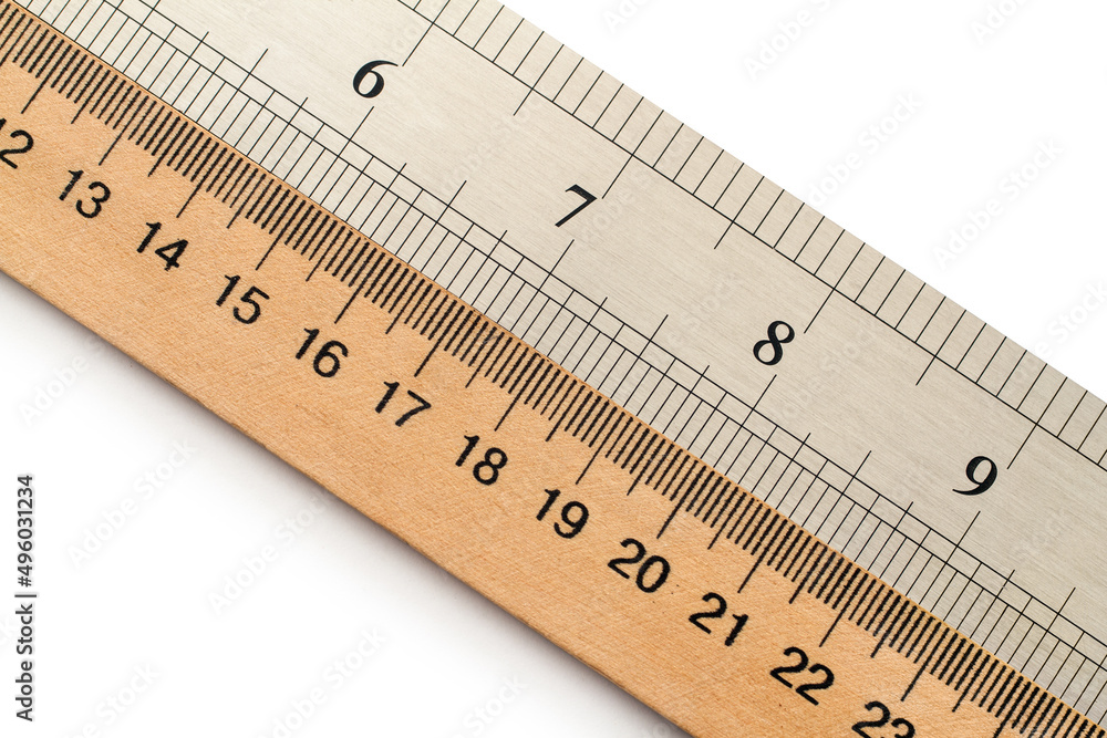 Wooden and metal rulers in centimeters and inches. Wooden and metal rulers in centimeters and inches.