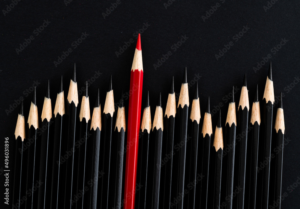 Red pencil standing out from the crowd Red pencil standing out from the crowd