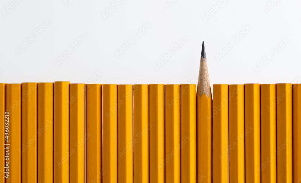 A row of pencils with one different direction A row of pencils with one different direction