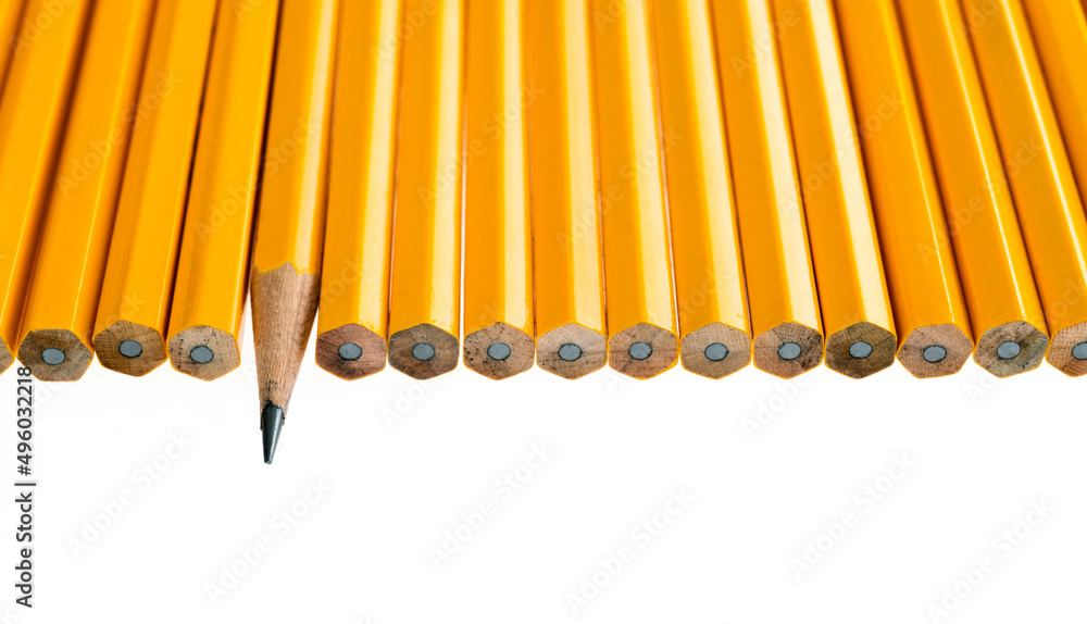 A row of pencils with one different direction A row of pencils with one different direction
