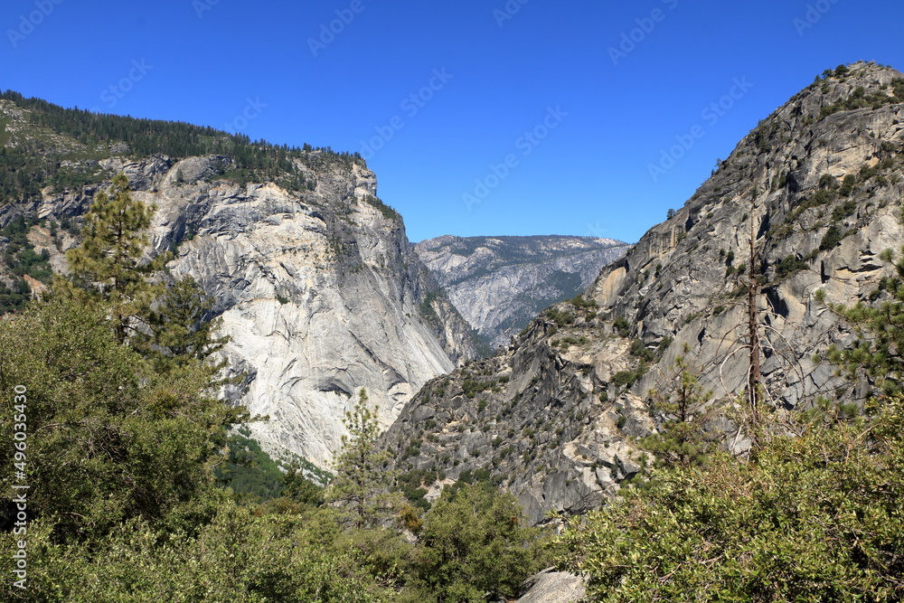 The Merced River flows at the bottom of Tenaya Canyon in Yosemite National Park, California