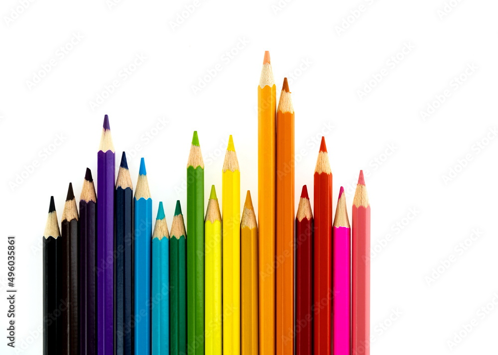 A row of color pencils on white background A row of color pencils on white background