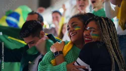 Brazilian young football fans celebrating their team's victory at stadium.