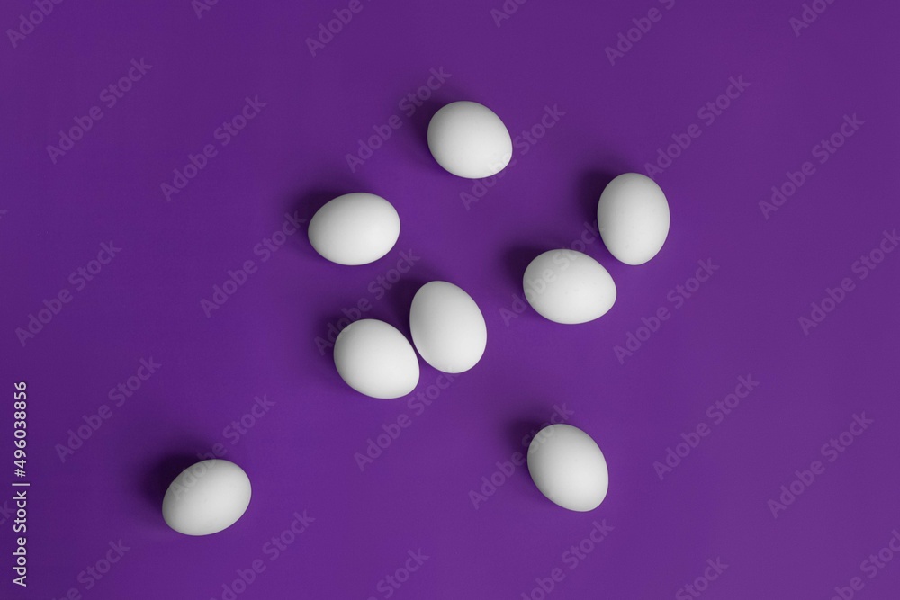 white eggs in a grid on a purple background postcard for easter minimalism white eggs in a grid on a purple background postcard for easter minimalism