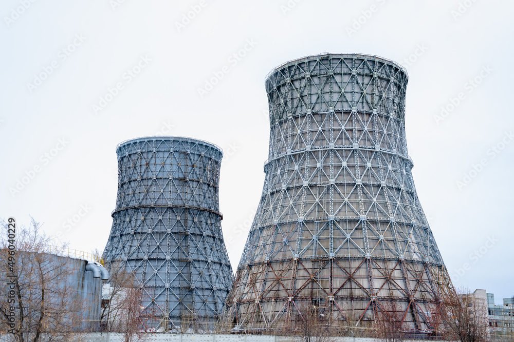 Gas combined heat and power plant with huge pipes, smoke, steam, power stations.