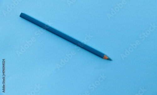 Blue color pencil on blue background