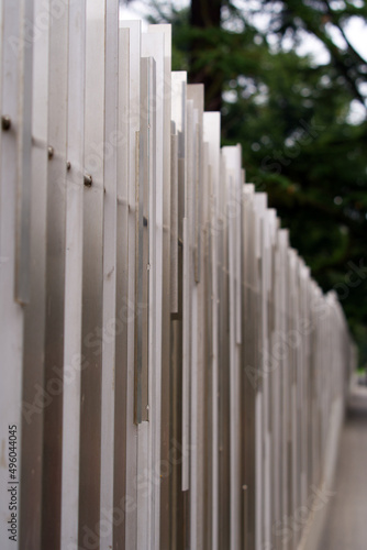 Metal fence with abstract geometric pattern at City of Geneva on a cloudy spring day. Photo taken March 18th, 2022, Geneva, Switzerland.