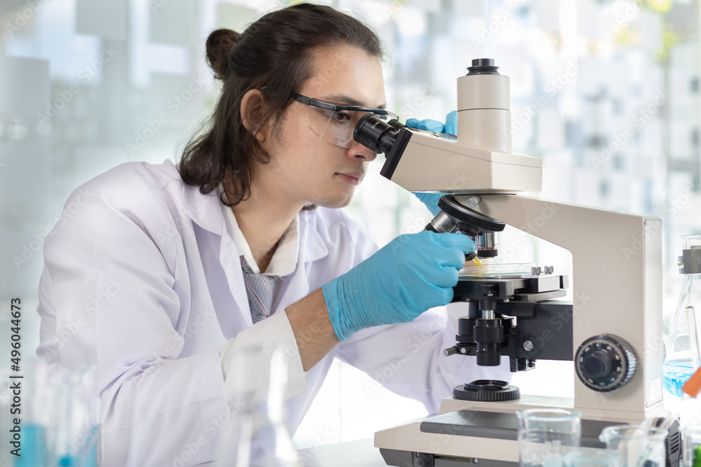 Scientists or researchers perform microscopic endoscopy to examine changes in the chemical reactions and degradation of cells, Lab experiments, Researchers scientist working analysis with test tube. Scientists or researchers perform microscopic endoscopy to examine changes in the chemical reactions and degradation of cells, Lab experiments, Researchers scientist working analysis with test tube.