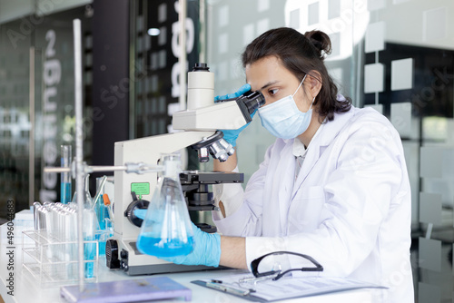 Obraz na plátně Scientists or researchers perform microscopic endoscopy to examine changes in the chemical reactions and degradation of cells, Lab experiments, Researchers scientist working analysis with test tube