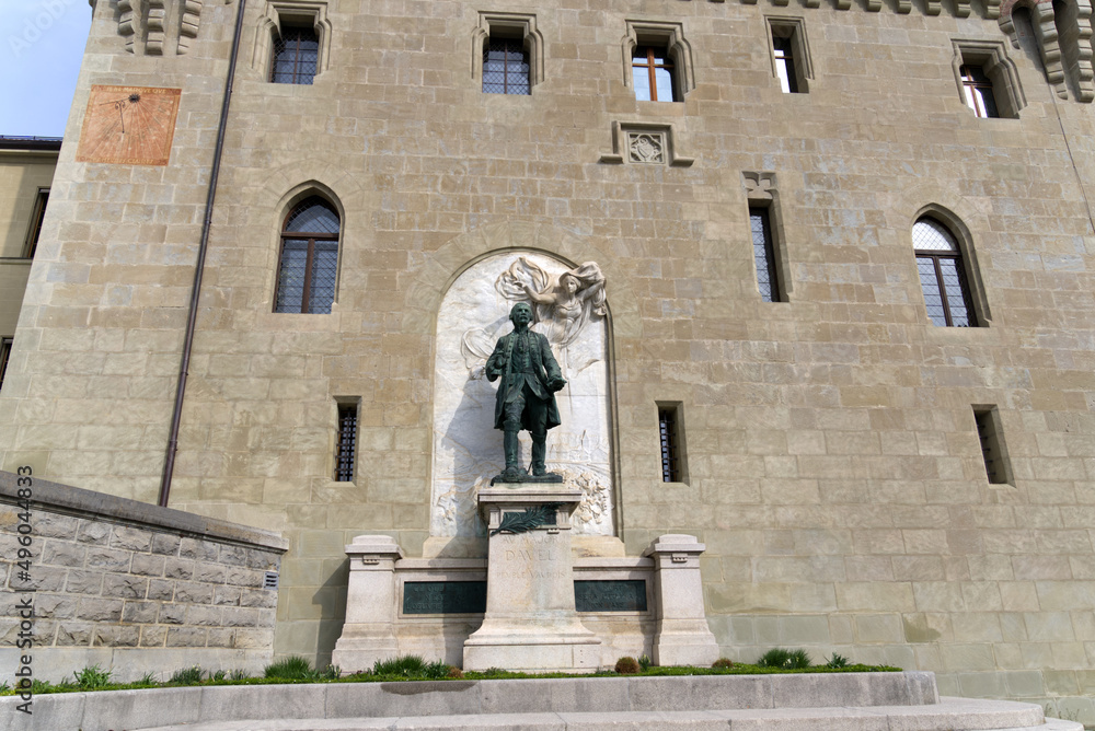 Statue of Major Davel in front of Medieval Château Saint-Maire (St. Maire Castle) at City of Lausanne on a spring day. Photo taken March 18th, 2022, Lausanne, Switzerland.