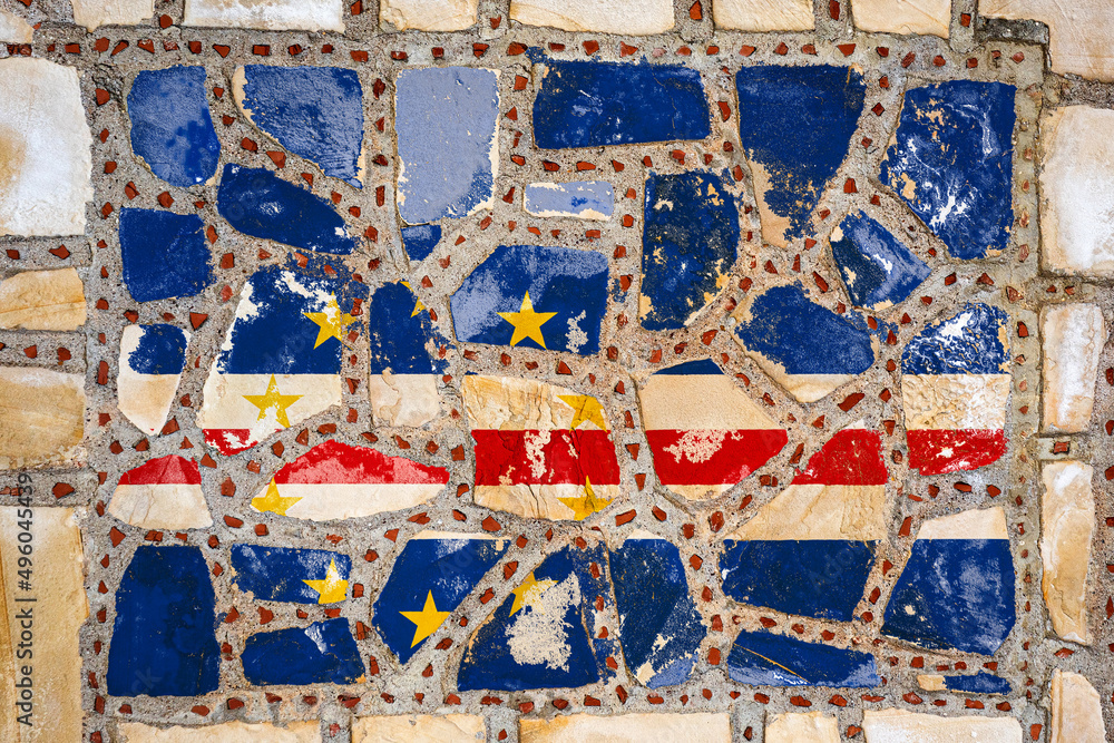 Naklejka premium National flag of Cape Verde on stone wall background. Flag banner on stone texture background.