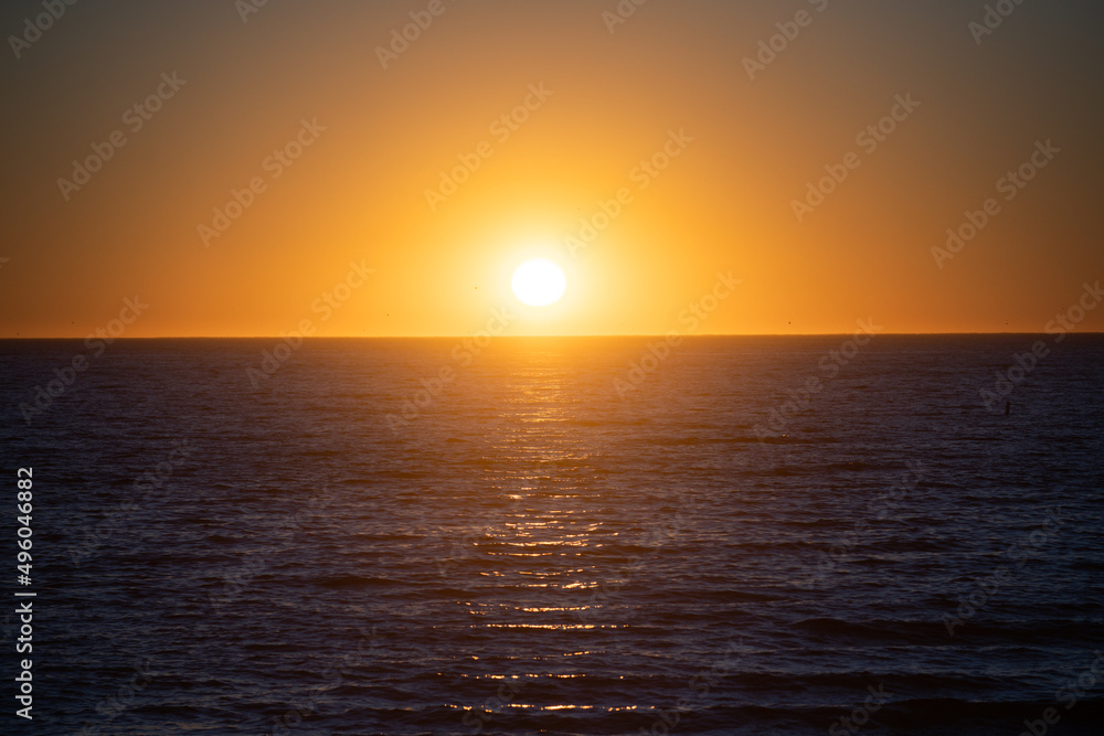 Calm sunrise sunset over the sea waves. Sunrise over the ocean.