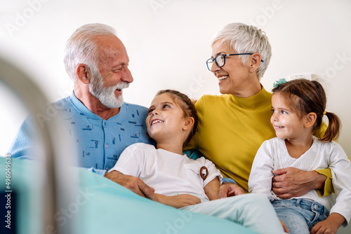 Happy children having fun and love with their grandparents together. Family poeple fun concept