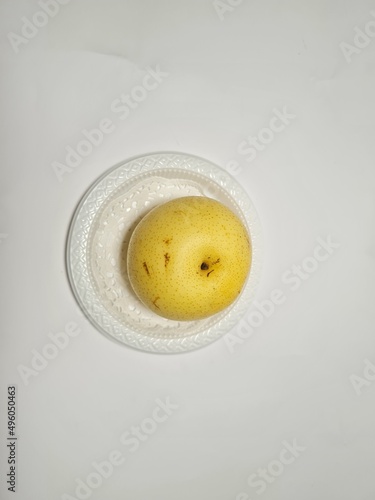 Light yellow pear on white background