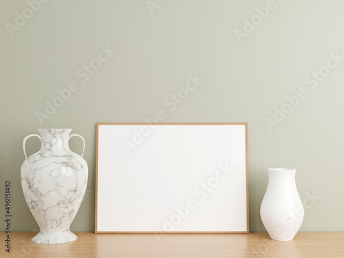 Minimalist horizontal wooden poster or photo frame mockup on wooden floor leaning against the wall.