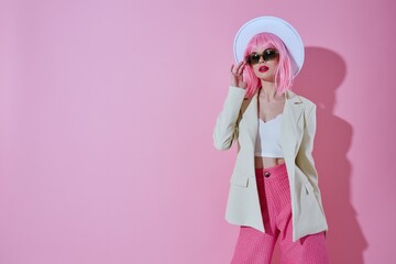 Beautiful fashionable girl hat with sunglasses fashion color background unaltered