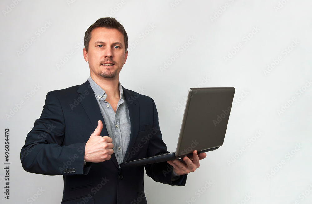 Young businessman using laptop computer on white background Young businessman using laptop computer on white background