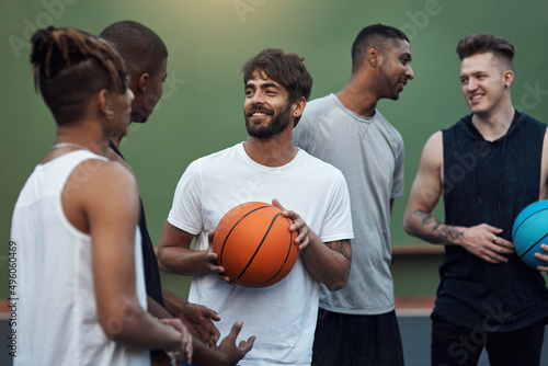 You guys up for another game. Shot of a group of sporty young men hanging out on a basketball court. © N Felix/peopleimages.com