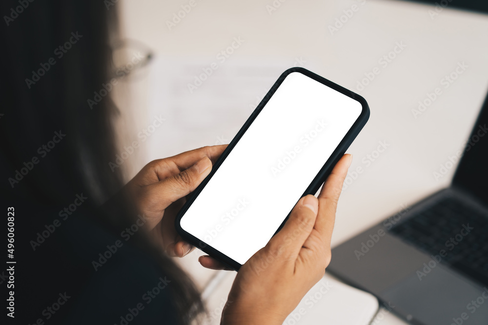 Woman showing smartphone with blank screen for advertise.