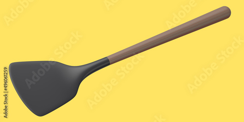 Silicon solid turner or kitchen utensils on yellow background. photo