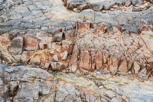 Volcaniclastic sedimentary rock in  Geo Park, Lai Chi Chong, Hong Kong photo