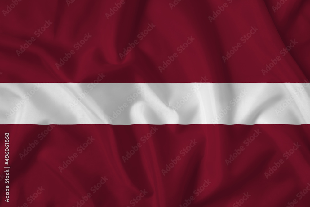 Latvia flag with fabric texture. Close up shot, background Latvia flag with fabric texture. Close up shot, background