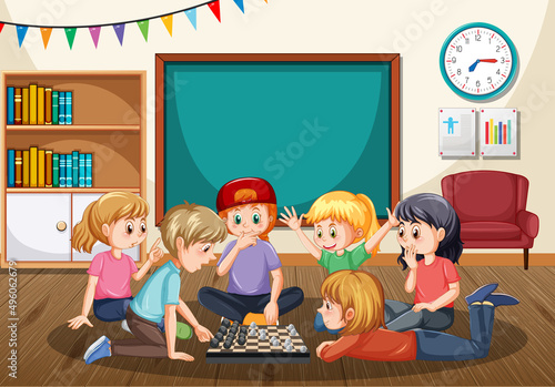 Children playing chess board in classroom