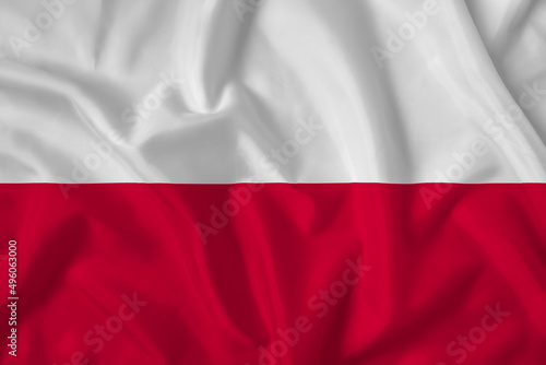 Poland flag with fabric texture. Close up shot, background