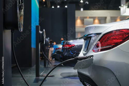 The power supply connects to electric vehicles to charge batteries, charging industrial transport technology, which is the future of EV vehicles. Fuel is plugged into a hybrid vehicle. at the launch e