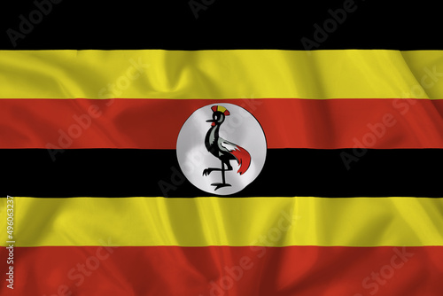 Uganda flag with fabric texture. Close up shot, background