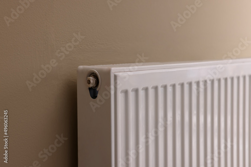 Wallpaper Mural Modern radiator on beige wall, closeup. Central heating system Torontodigital.ca