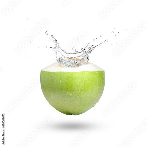 Green coconut with coco nut water splash isolated on white background. photo
