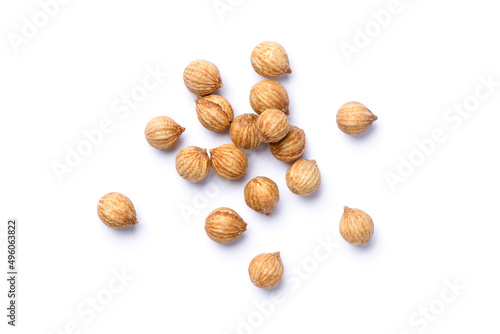 Dried coriander seeds isolated on white background. Top view. Flat lay.
