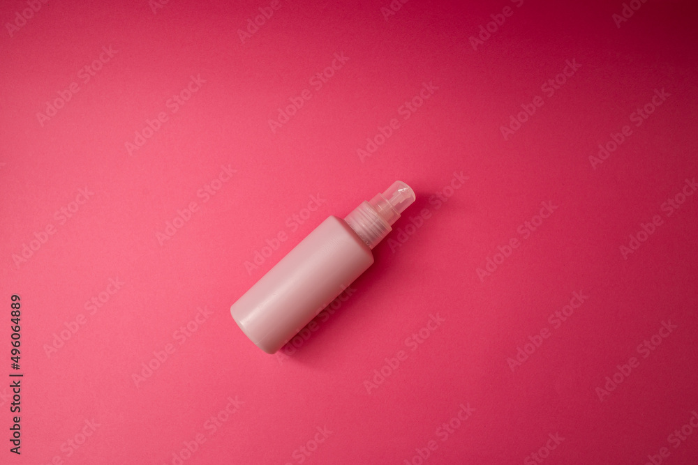 Jar with antiseptic on a pink background Jar with antiseptic on a pink background