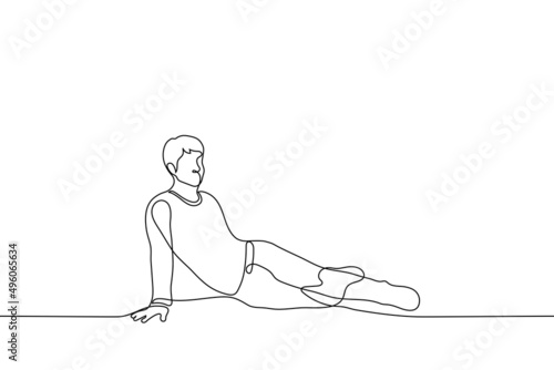 man seductively sitting on floor leaning with one hand - one line drawing vector. concept playful graceful young man sitting, queer