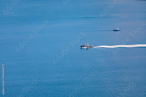 Speed Boat sailing across coastline, sea near Tolo Channel, Hong Kong