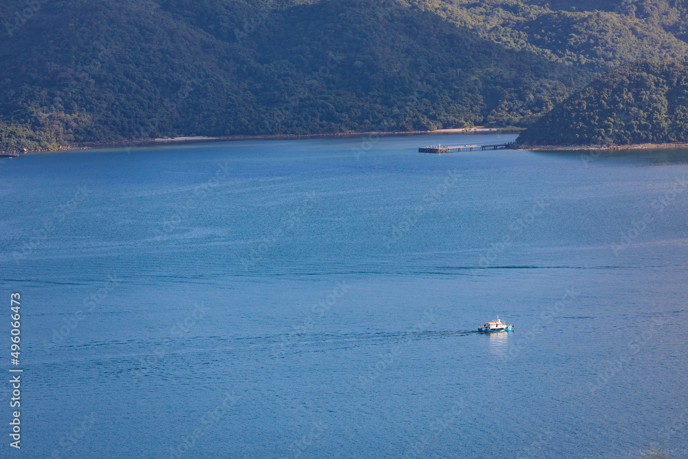 Obraz premium Speed Boat sailing across coastline, sea near Tolo Channel, Hong Kong