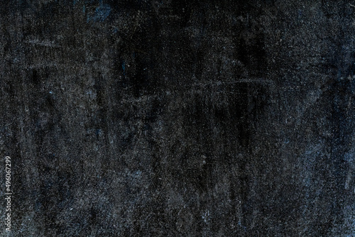 Dark grunge textured old abandoned cement plaster wall