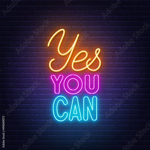 Yes You Can neon lettering on brick wall background.