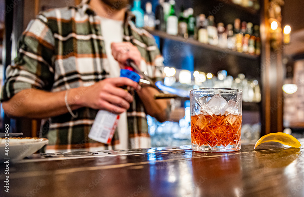 man hand bartender making glass negroni cocktail in bar man hand bartender making glass negroni cocktail in bar