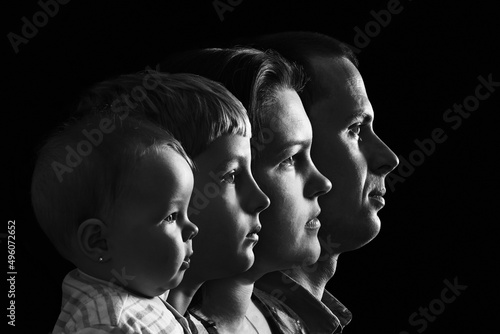 Family photo in profile on a black background.