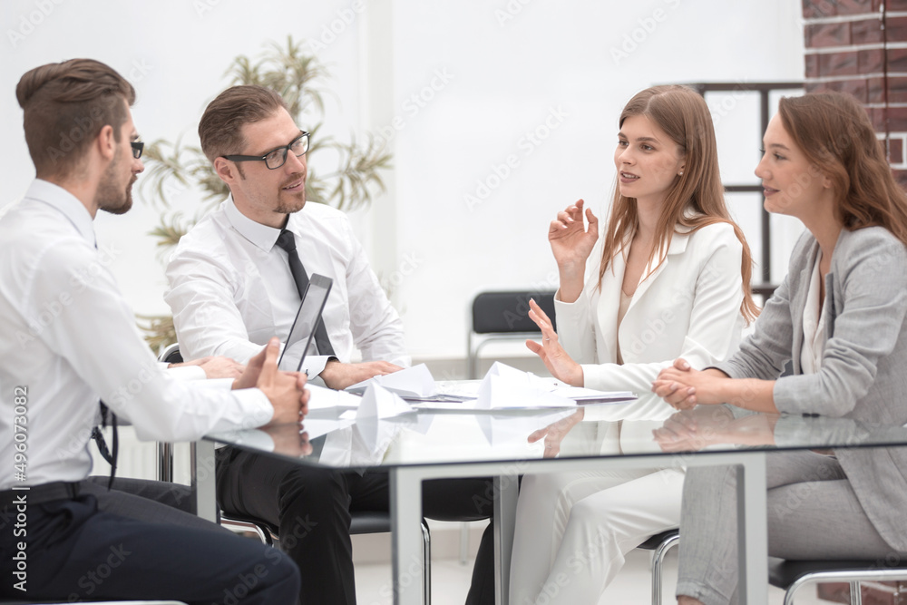 boss and business team sitting at the Desk. boss and business team sitting at the Desk.
