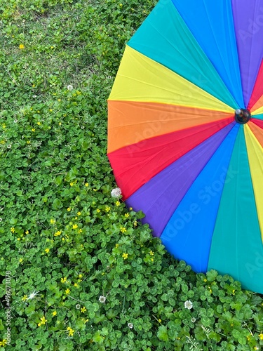 Paraguas colores abierto sobre cesped fondo lgtbi photo