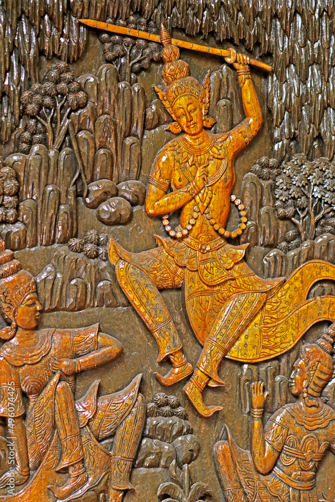 Traditional Thai style wood craving on the wall of church in Thai temple