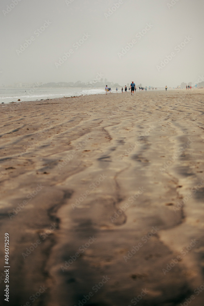 people walking on the beach on coronado island people walking on the beach on coronado island
