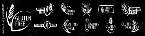 A set of painted gluten free signs on a black background