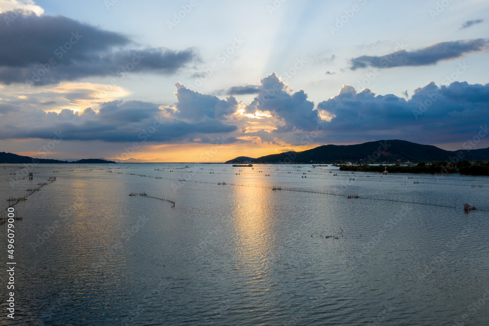 Beautiful sunset over lake and mountain Beautiful sunset over lake and mountain