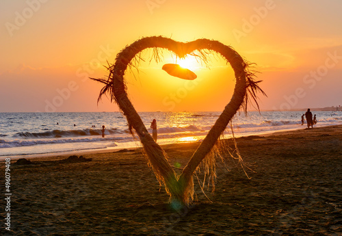 Fototapeta Naklejka Na Ścianę i Meble -  Heart model on a beach at sunset, Side, Turkey