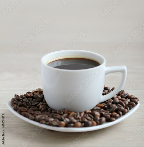 Coffee cup with coffee beans close up