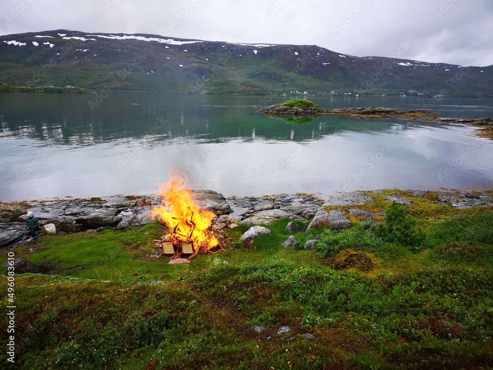 Arctic fjord bonfire
